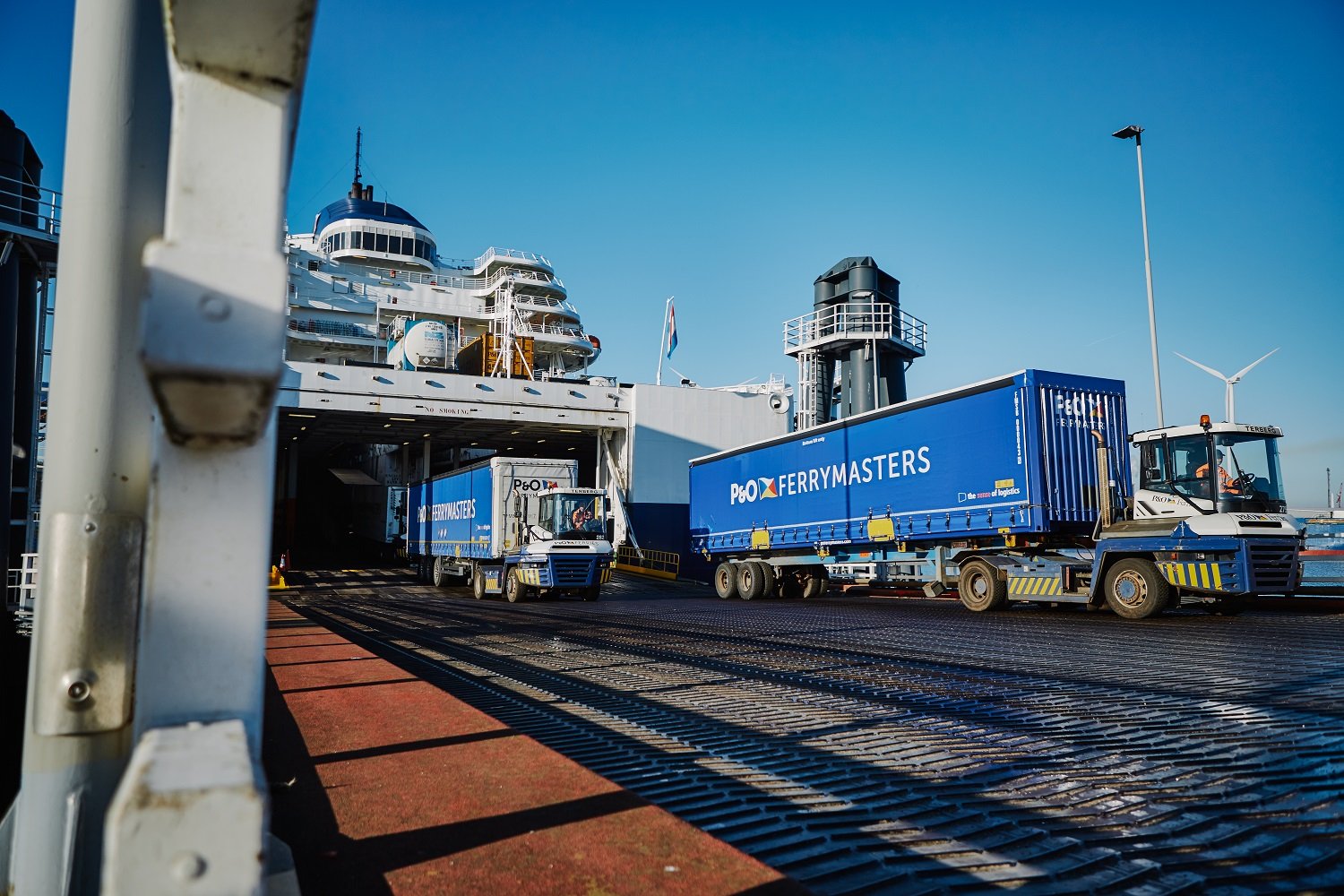 logistics - trucks leave boat