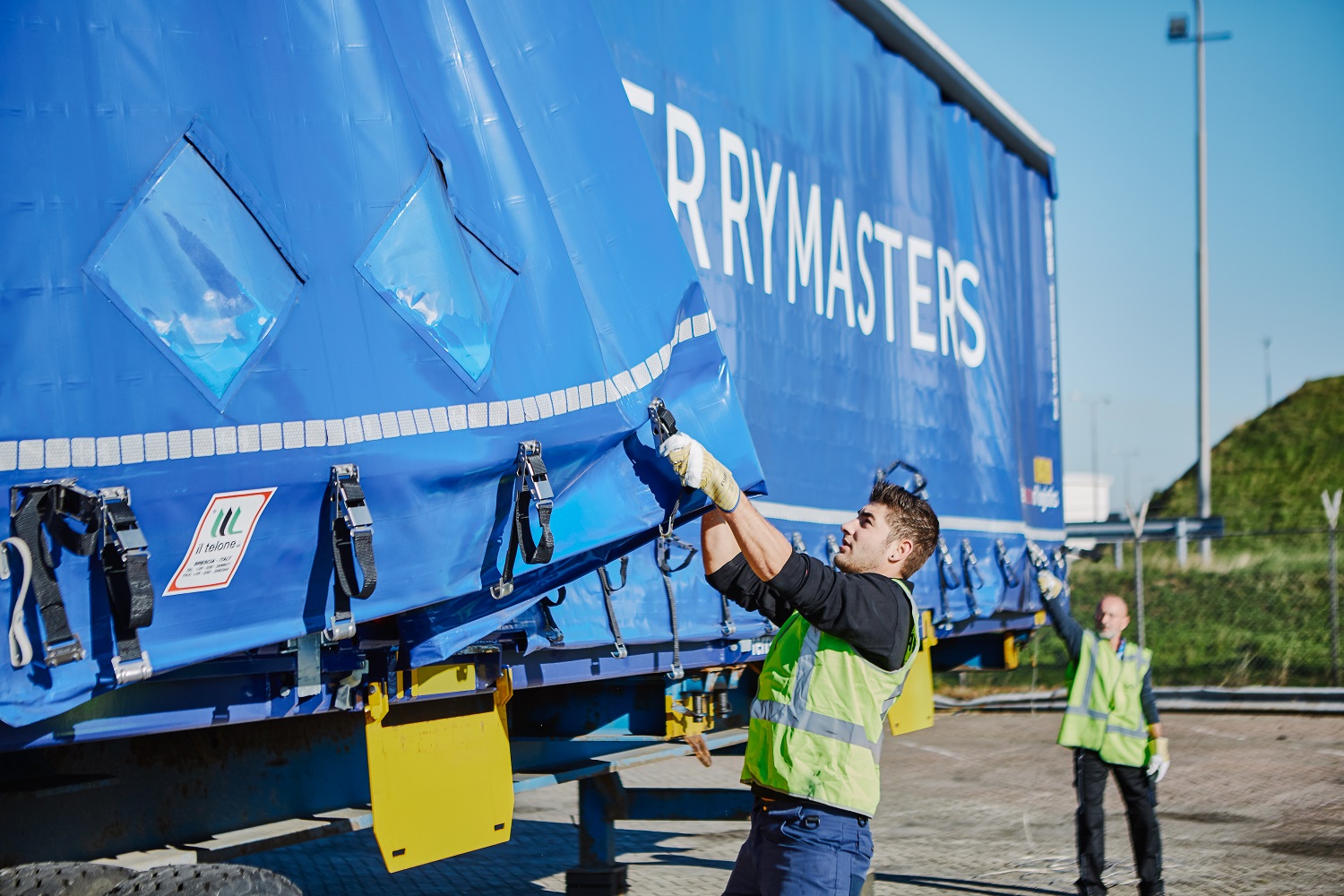 people at work on trailer